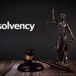 Insolvency text with gavel and Lady Justice