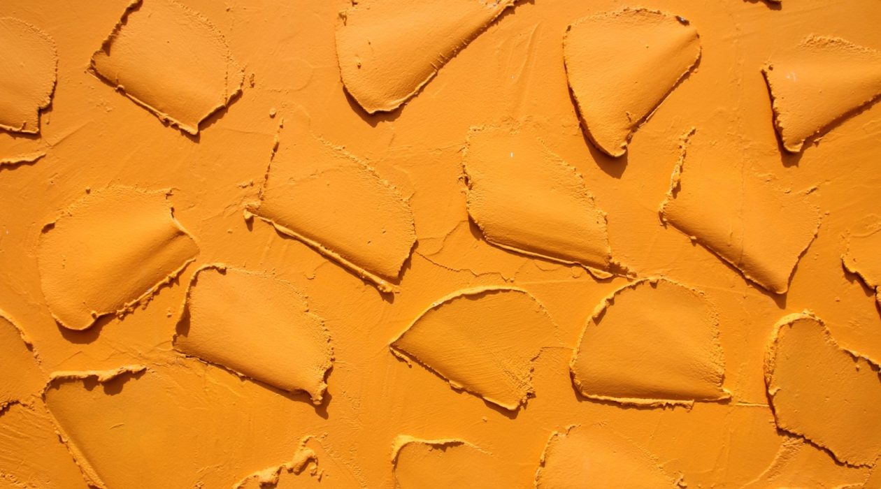 a close up of a yellow paint texture