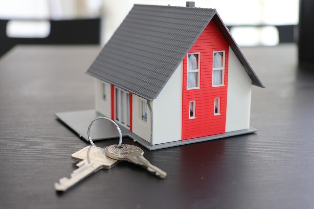 A toy house with the steel keys on the table